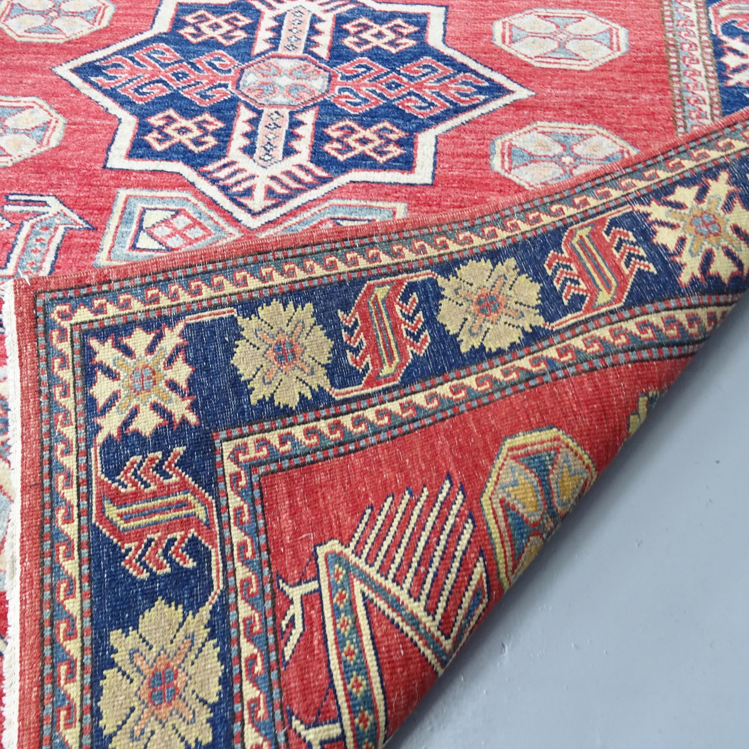 A red-ground Kazak rug. 172x121cm. Good overall condition. - Image 2 of 2