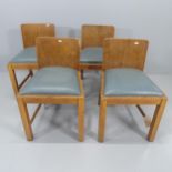 A set of four 1930s oak framed children's dining chairs with drop in seats.