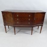 A reproduction mahogany sideboard of canted form, raised on six legs. With label for Strongbow
