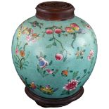 An Antique Chinese jar with carved wood cover and stand, overall height 25cm Chips to inside of rim,