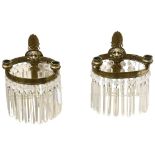 A pair of early 20th century lion head wall sconces, with crystal lustre drops, overall height