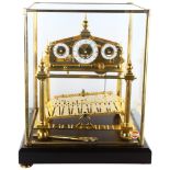 A 20th century brass Congreve clock, with rolling ball fusee movement housed in glass display