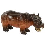 A 19th century porcelain hippopotamus, makers stamp to foot, length 36cm A/F Figure has been