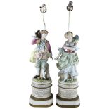 A pair of large Continental porcelain figures on lamp base of pierced metal, height of figures and