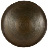 A heavy Eastern brass tray with allover engraving, diameter 68cm