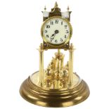 A 20th century German Anniversary Clock in domed glass case