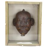 A carved and lacquered Japanese mask in glazed case, case length 25 x 21cm Some missing hair and