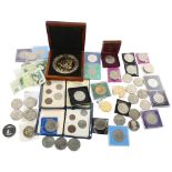 A collection of British commemorative coins, including Festival of Britain crowns, and 88mm Royal