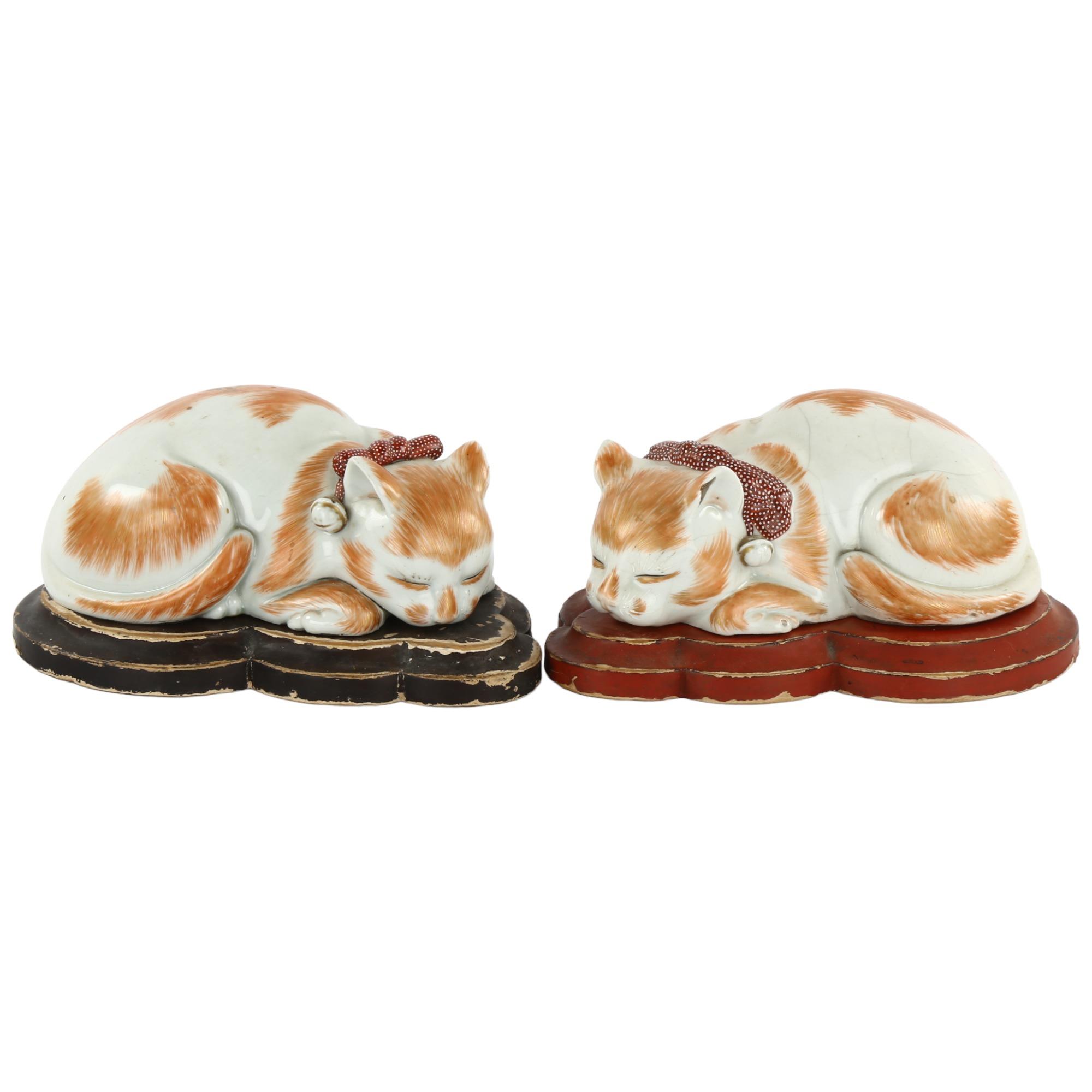 2 similar Japanese, Meiji period, sleeping porcelain cats, on original wooden stands, longest 17.5cm