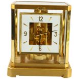 JAEGER LECOULTRE - a gilt-brass Atmos clock, square white lacquered dial with quarterly Arabic