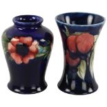 2 small Moorcroft pottery vases, height 9cm (2) Vase with flared rim has a very fine hairline