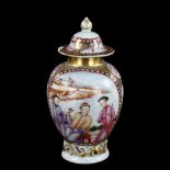 An Antique Chinese porcelain tea jar, with enamelled and gilded decoration on scrolled base,