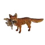 A cold painted bronze miniature of fox with pheasant, length 5cm Good condition, some chips and