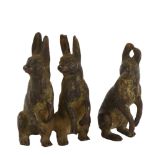 3 miniature cold painted bronze hares in 2 groups, height 4.5cm Rubbing to painting, 1 ear