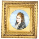 An 18th century painted portrait of a veiled lady on porcelain panel, in gilt frame, original