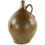 A large 18th Century salt glaze Bellarmine jug, height 44cm Several chips at base and body