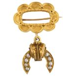 A Victorian Etruscan style split pearl memorial drop brooch, with a central vacant panel within