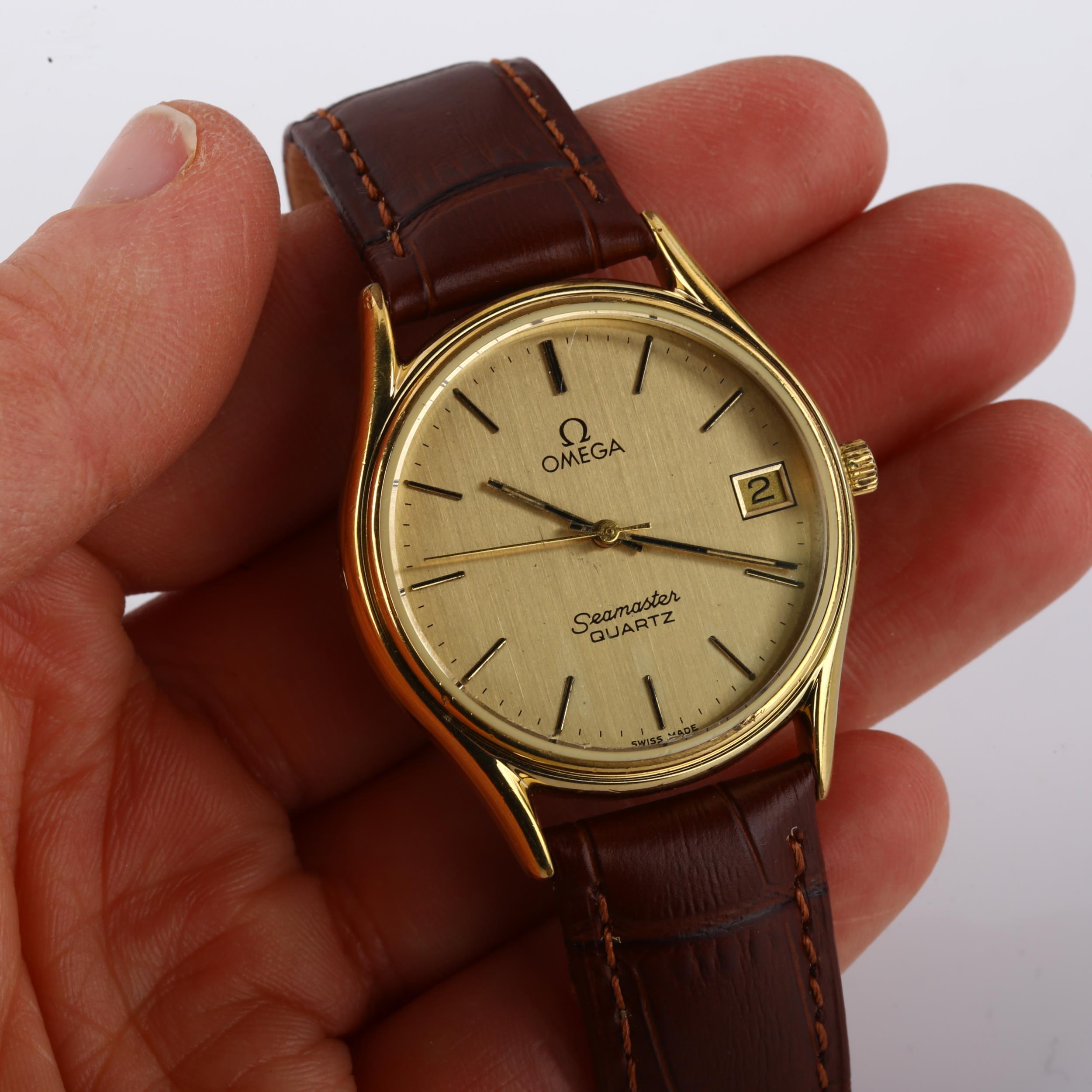 OMEGA - a gold plated stainless steel Seamaster quartz wristwatch, ref. 1337, champagne dial with - Image 5 of 5