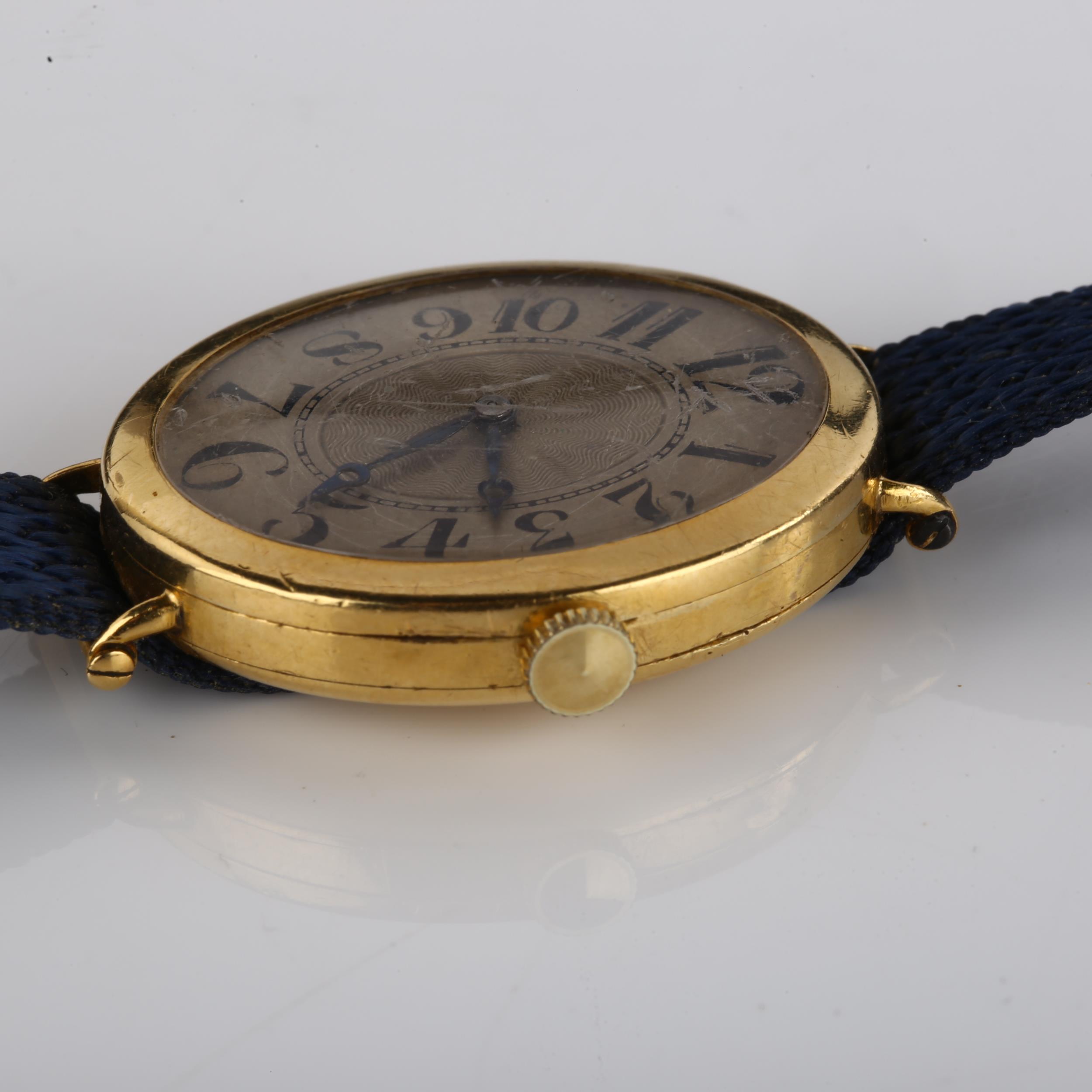 An Art Deco 18ct gold mechanical wristwatch, oval silvered dial with engine turned decoration, - Image 4 of 5