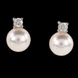 A pair of 18ct white gold whole pearl and diamond earrings, with stud fittings, earring height 10.