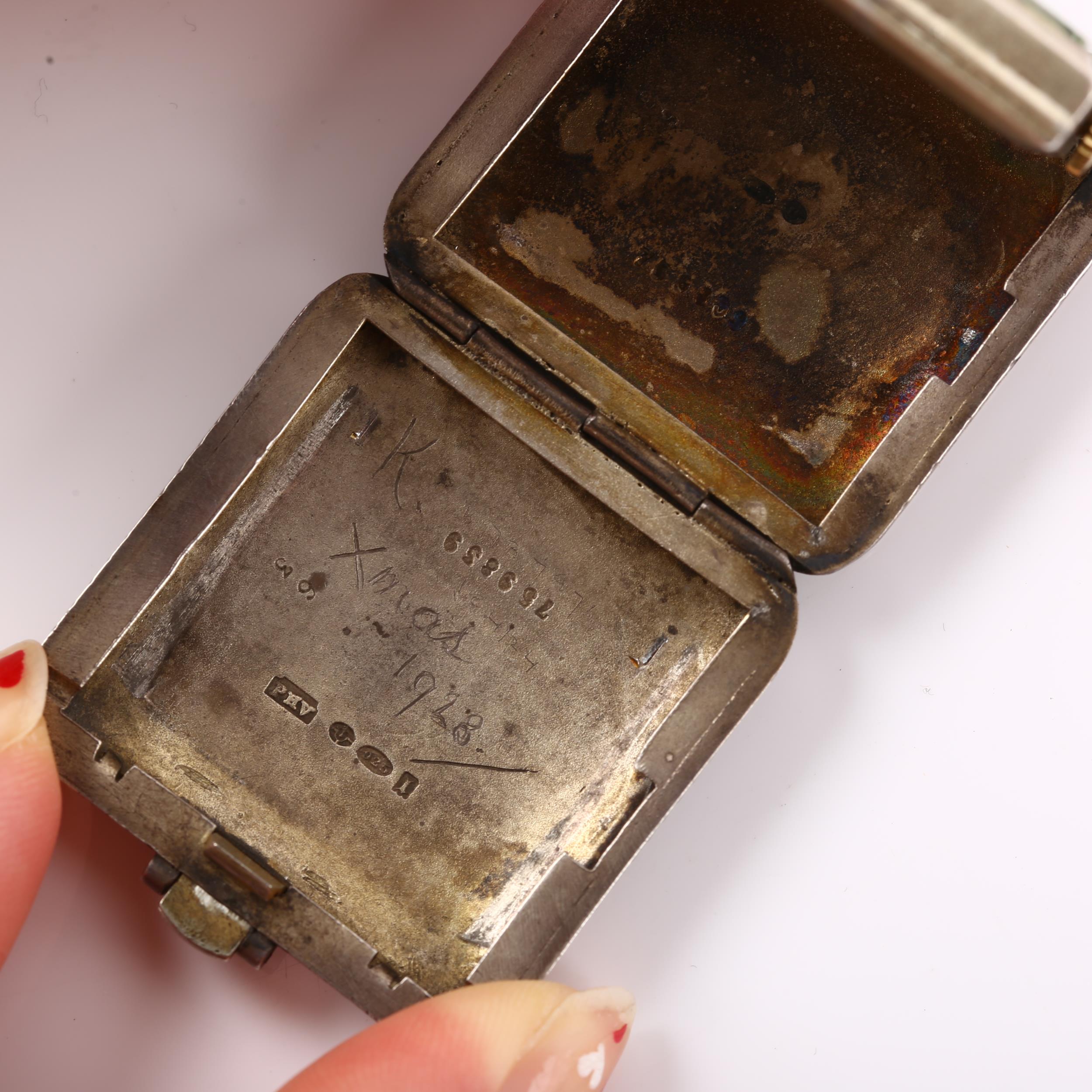 An Art Deco sterling silver and red enamel travelling bedside timepiece, square silvered dial with - Image 4 of 5