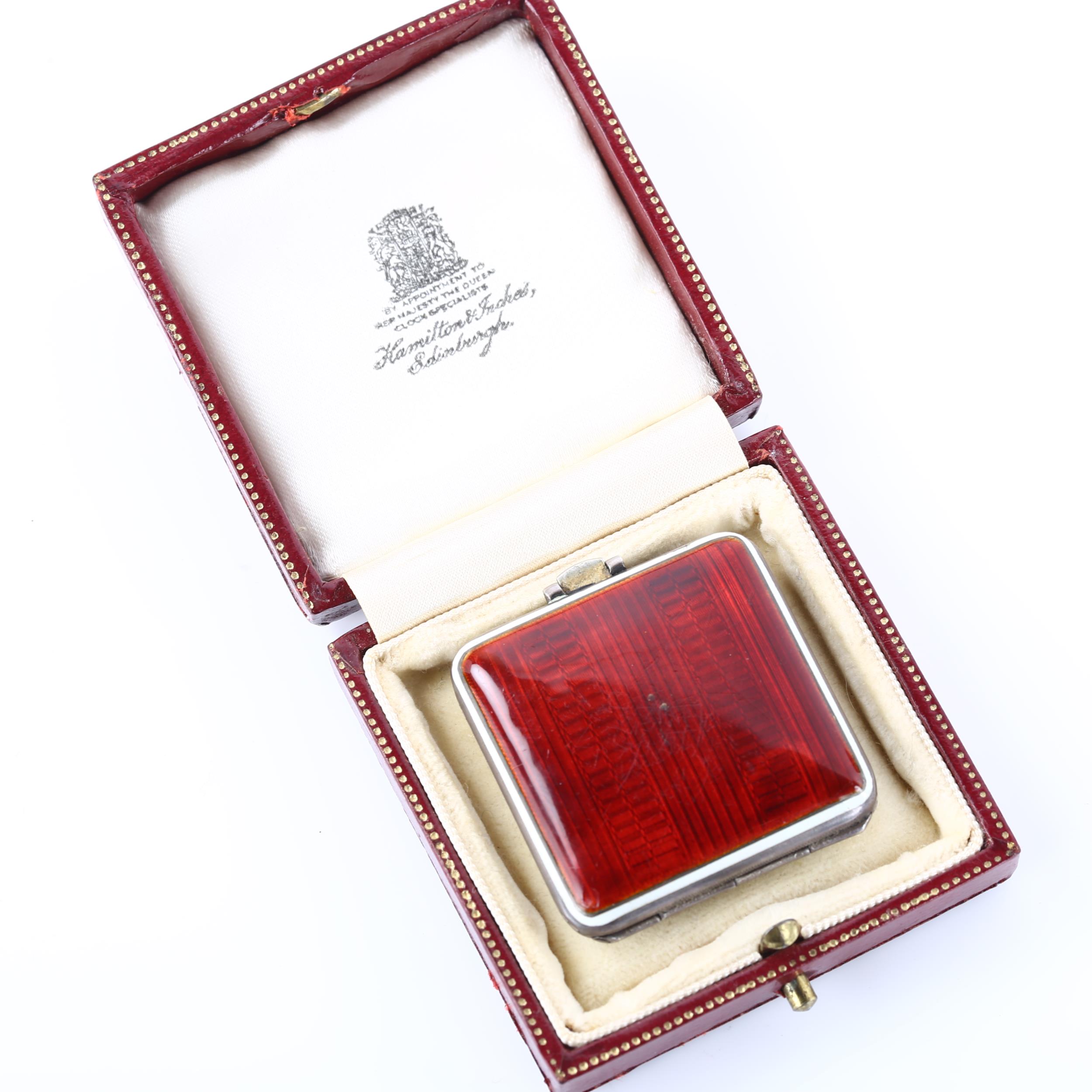 An Art Deco sterling silver and red enamel travelling bedside timepiece, square silvered dial with - Image 5 of 5