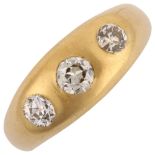 An early 20th century 18ct gold three stone diamond gypsy ring, set with old European-cut