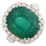 A modern 18ct white gold emerald and diamond cluster ring, set with 6.5ct oval cushion-cut emerald