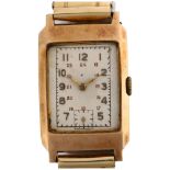 An Art Deco 9ct gold mechanical bracelet watch, silvered dial with gilt Arabic numerals and