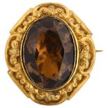 A Victorian foil-backed smoky quartz brooch, unmarked yellow metal closed-back settings with