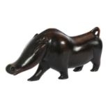 An African stylised carved hardwood sculpture of a warthog, L53cm, H27cm Good overall condition,