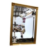 A modern gilt-framed bevel-edge wall mirror, 73cm x 51cm