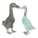 A verdigris bronze duck, H34cm, and a verdigris metal duck, H37cm The verdigris bronze duck is in