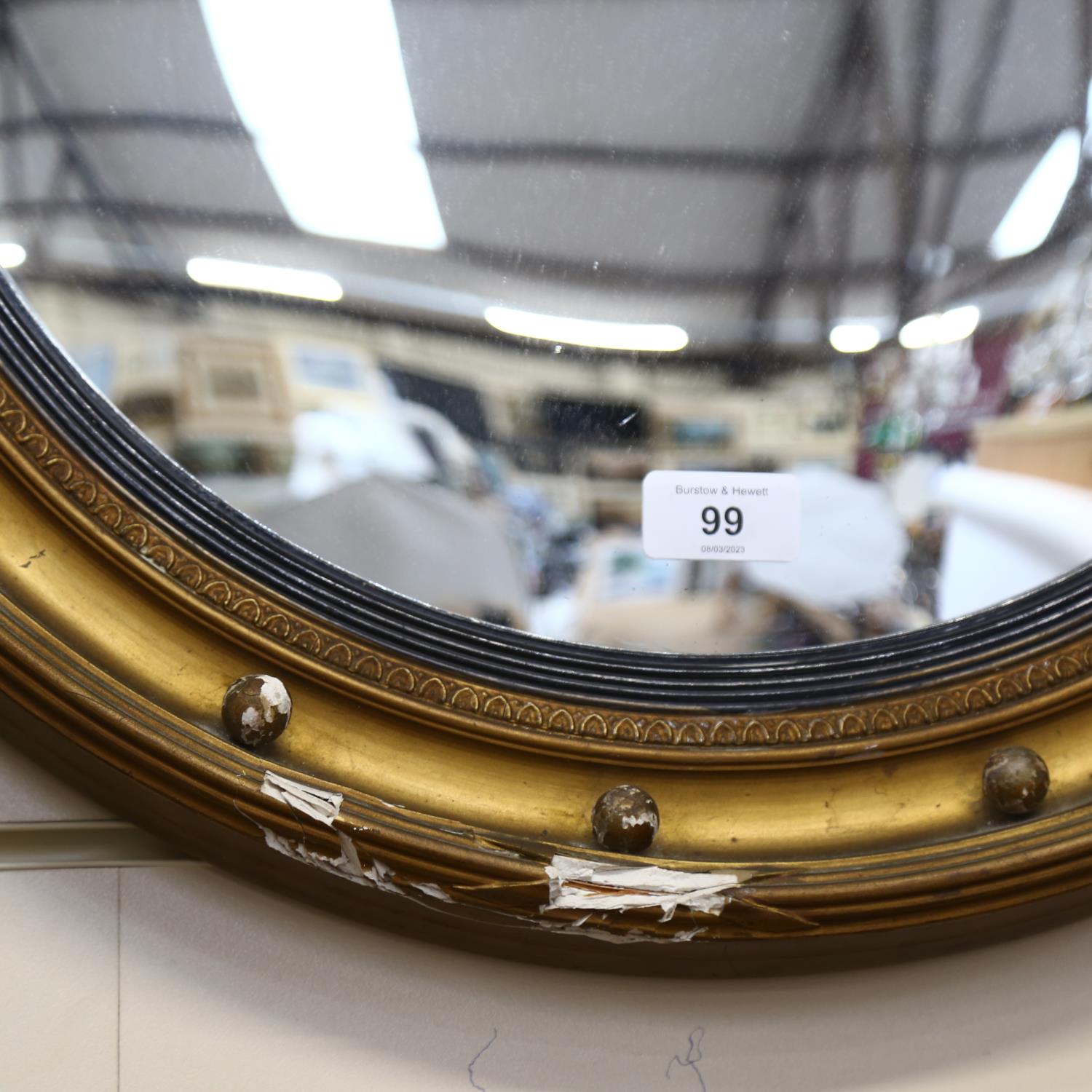 A gilt-framed circular convex wall mirror, diameter 54cm (frame damaged) - Image 2 of 2