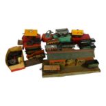 A quantity of Vintage Hornby trains and accessories, including tin station diorama, and O gauge