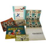 A collection of cartoon books, including Flook by Trog