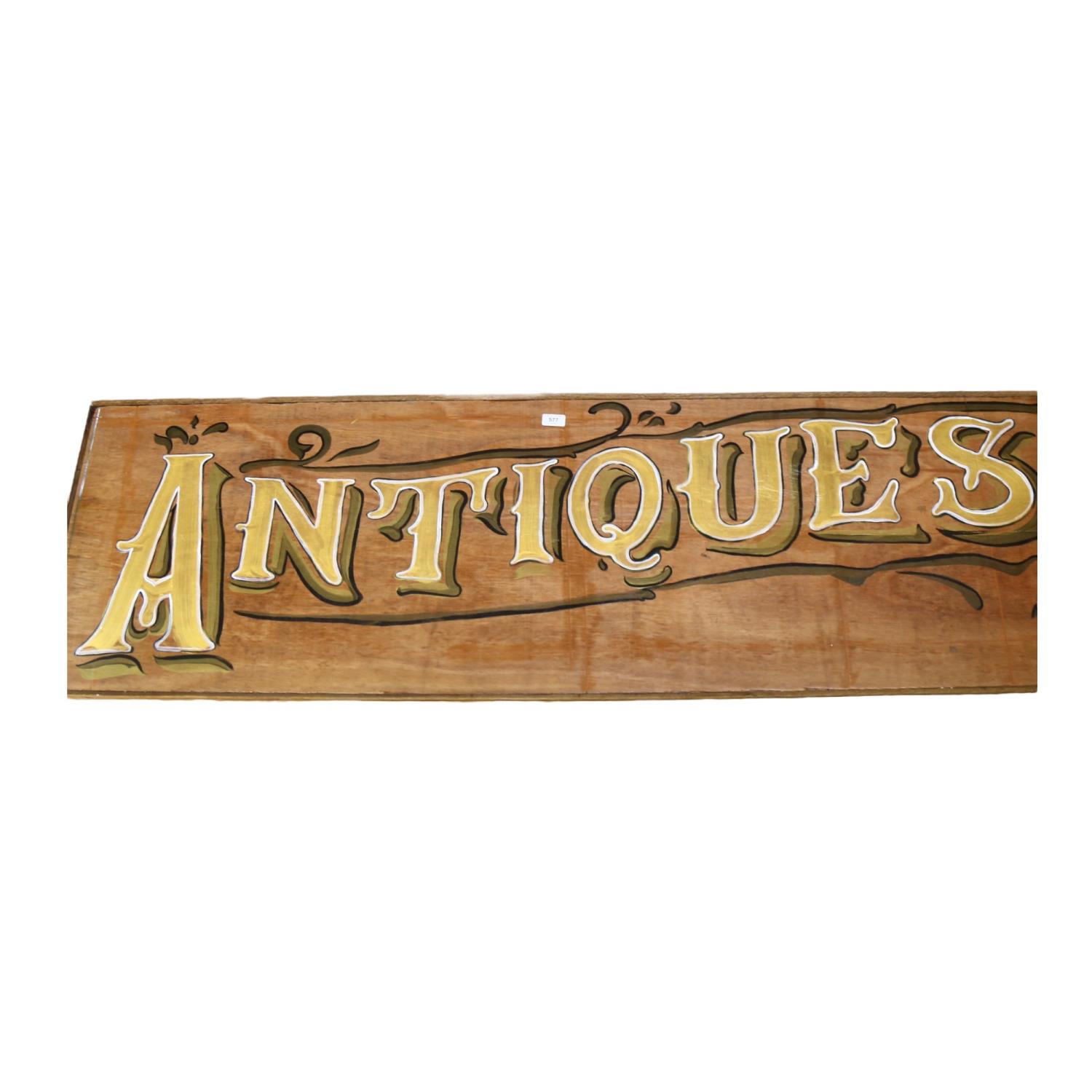 Clive Fredriksson, a large painted wood sign "Antiques", L168cm