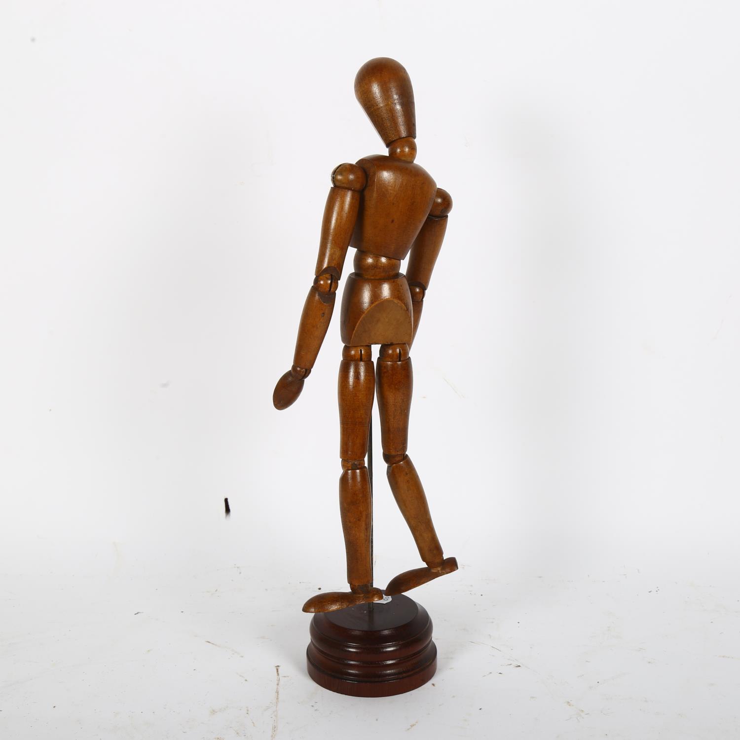 An artist's lay figure of jointed form, on turned wood base, H36cm - Image 2 of 2