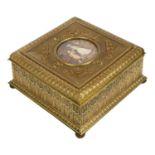 An ornate French gilt-metal casket, circa 1900, central hand painted ivorine panel depicting 2