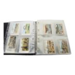 LIEBIG - a collection of 33 sets of Liebig trade cards, in a presentation folder, including a