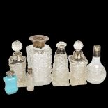 A pair of cut-glass and silver-mounted scent bottles, and 5 other silver-mounted toilet bottles