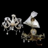 A pressed metal chandelier with mythical bird decoration, and associated glass lustres, drop