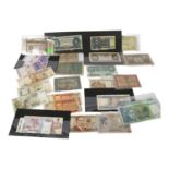 A large quantity of world banknotes, including French 100 francs, 20 Hong Kong dollars, blue £5