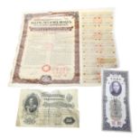Various Chinese bonds, including 5% Gold Bond 1925, and a 1941 newspaper