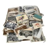 A box of various early postcards and an empty photograph album (2)