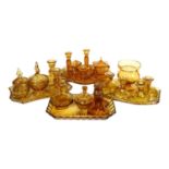 4 x 1930s amber glass dressing table trays, and matching dressing table items, including jars and