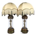 A pair of American gilded spelter and crackle glazed table lamps, with domed tasselled shades,