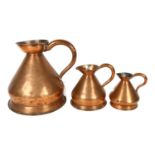 A graduated set of Antique copper measures, H28cm