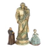 A painted plaster religious group, figure and child, H32cm, a cast-iron crinoline lady, and a carved