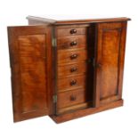 A Victorian mahogany table-top collector's chest, the 2 panelled doors opening to reveal 2 short and
